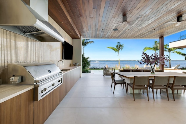 view of patio / terrace featuring sink, grilling area, and exterior kitchen