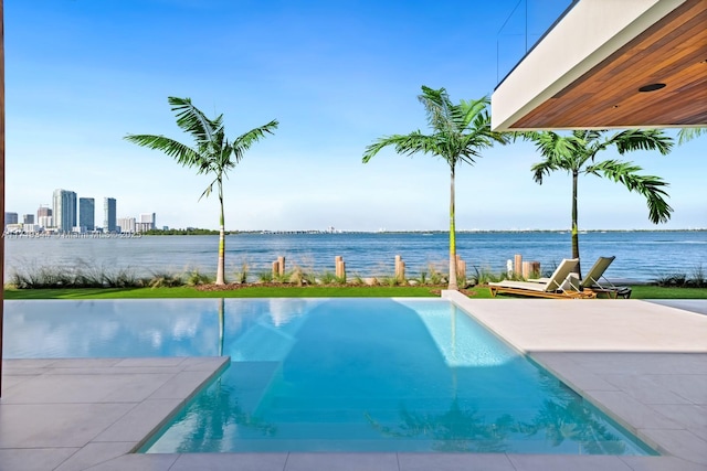 view of pool featuring a water view