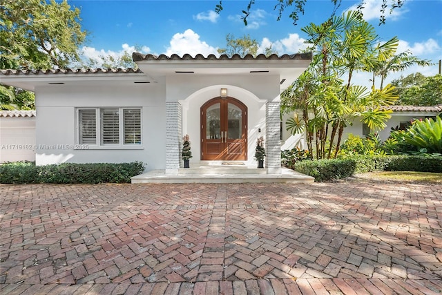 property entrance featuring french doors