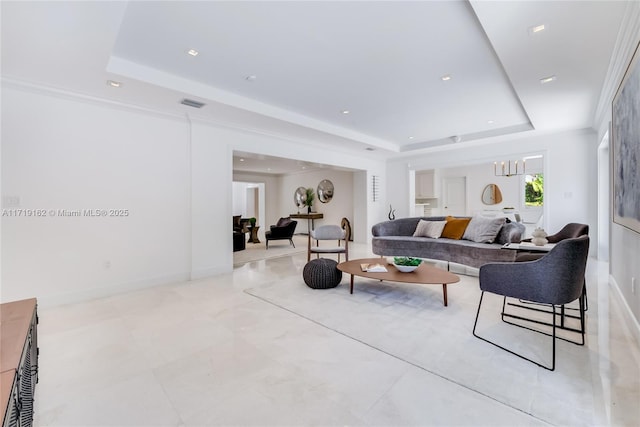 living room featuring a tray ceiling