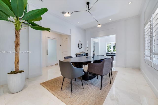 dining area featuring ornamental molding