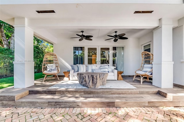 view of patio featuring french doors, ceiling fan, and outdoor lounge area