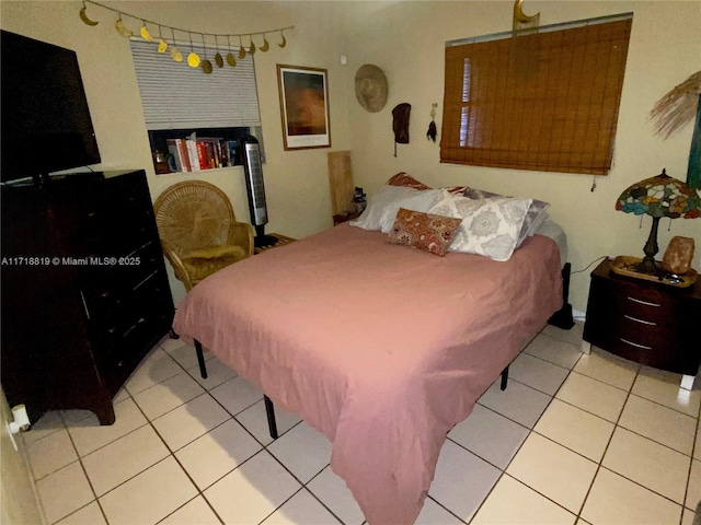 bedroom featuring light tile patterned floors