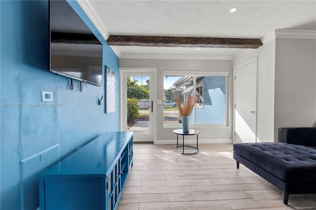 living area featuring beam ceiling, crown molding, a textured ceiling, and light wood-type flooring