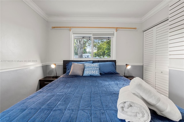 bedroom featuring a closet and ornamental molding