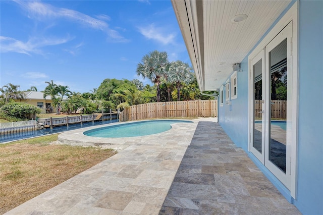 view of swimming pool with a patio area