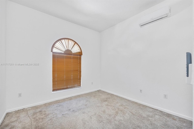 carpeted empty room featuring an AC wall unit