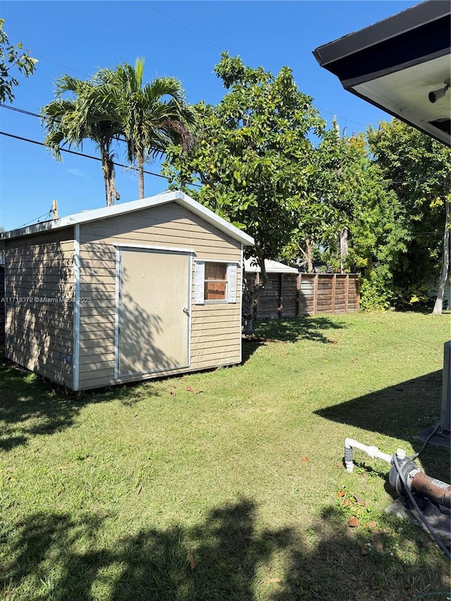 view of yard with a storage unit