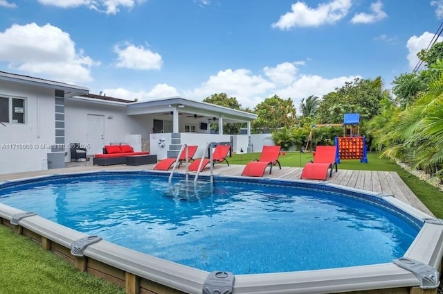 view of swimming pool with a deck