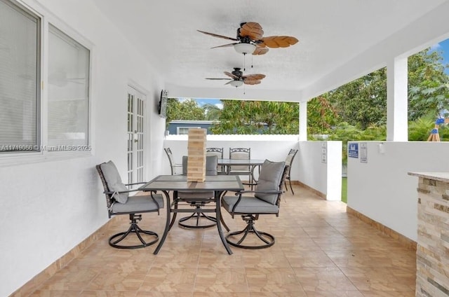 view of patio with ceiling fan and french doors