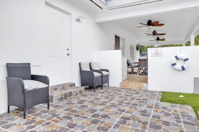 view of patio / terrace featuring ceiling fan