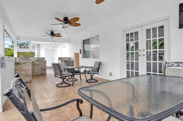 view of patio featuring french doors and an outdoor kitchen