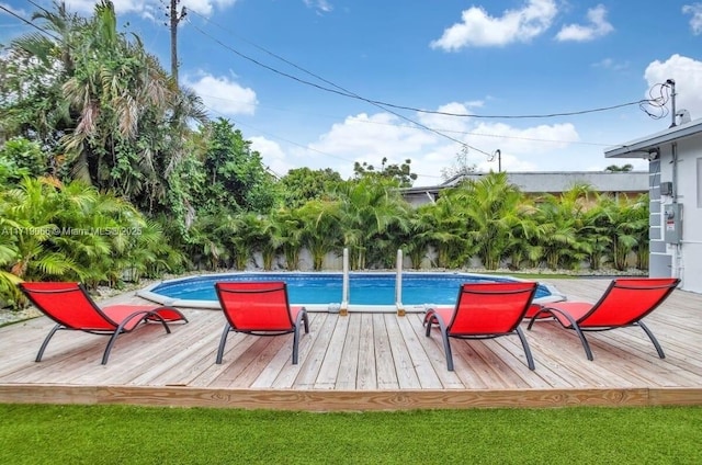 view of swimming pool with a wooden deck