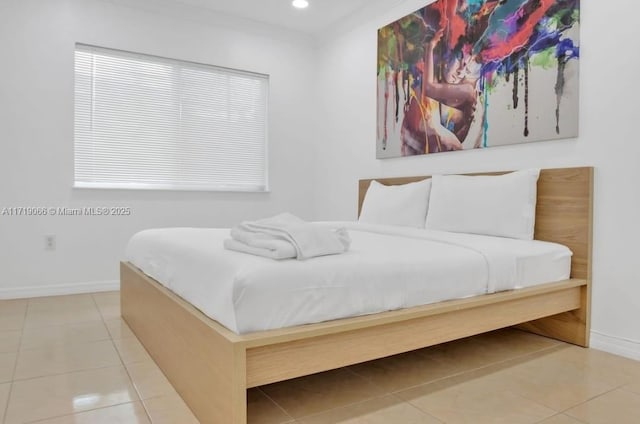 bedroom featuring light tile patterned floors