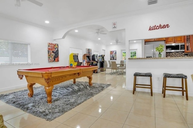 game room featuring light tile patterned flooring, ceiling fan, crown molding, and pool table