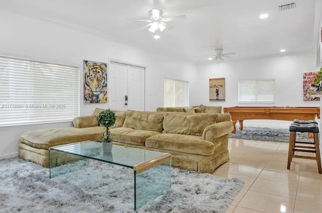 tiled living room featuring ceiling fan, billiards, and ornamental molding