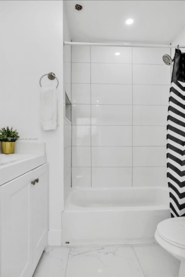 full bathroom with shower / bathtub combination with curtain, vanity, and toilet