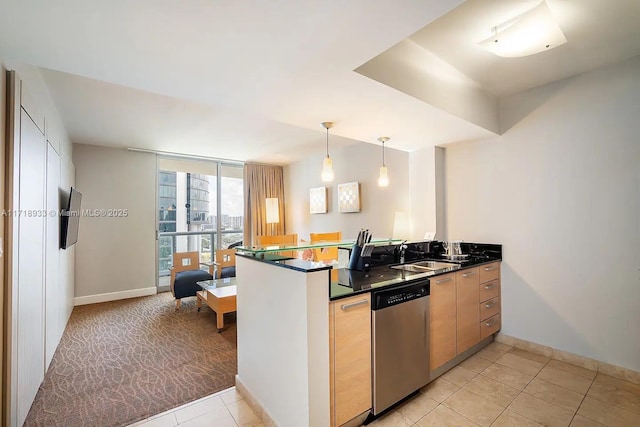 kitchen featuring kitchen peninsula, dishwasher, floor to ceiling windows, and sink