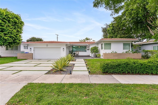 single story home with a garage