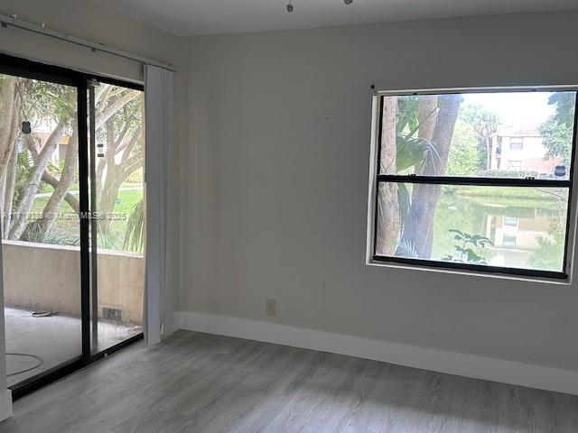 unfurnished room with light hardwood / wood-style flooring