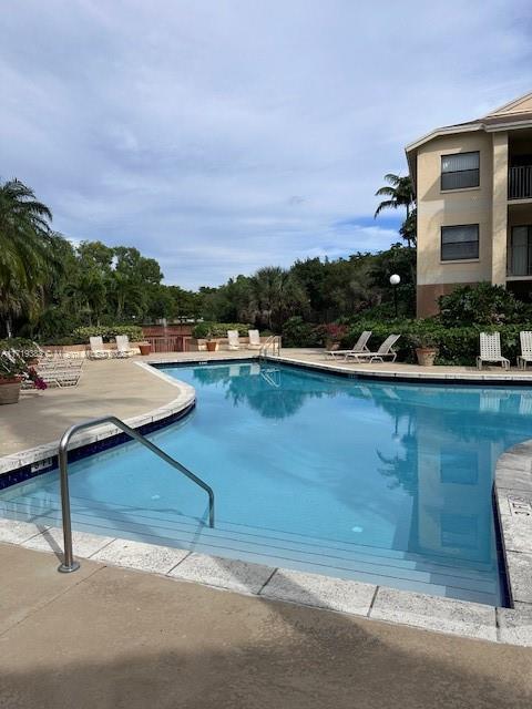 view of swimming pool featuring a patio area