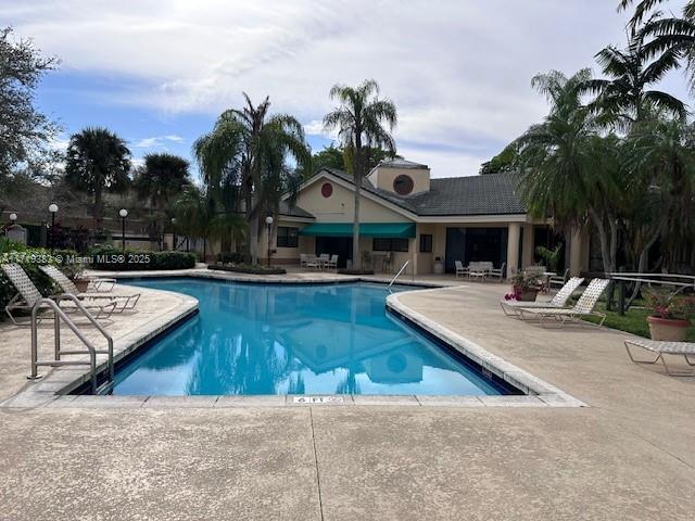 view of swimming pool featuring a patio