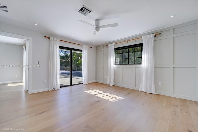 empty room featuring ceiling fan and light hardwood / wood-style floors