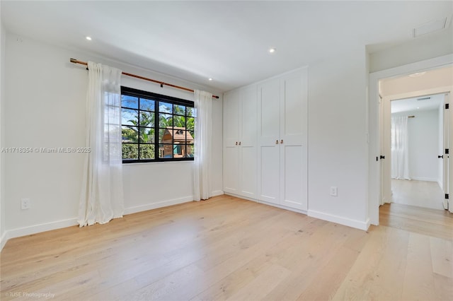 unfurnished room featuring light wood-type flooring