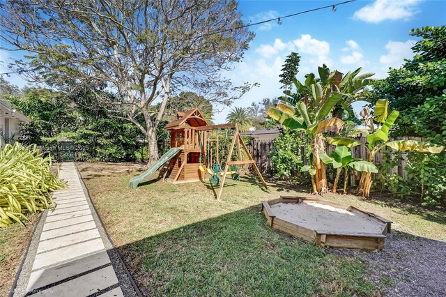 view of jungle gym with a lawn