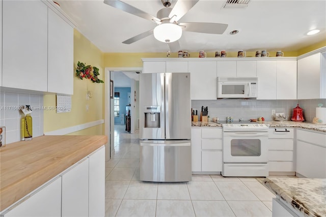 kitchen with white cabinetry, ceiling fan, tasteful backsplash, white appliances, and light tile patterned floors