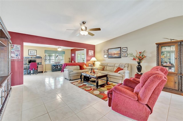 tiled living room with ceiling fan and lofted ceiling