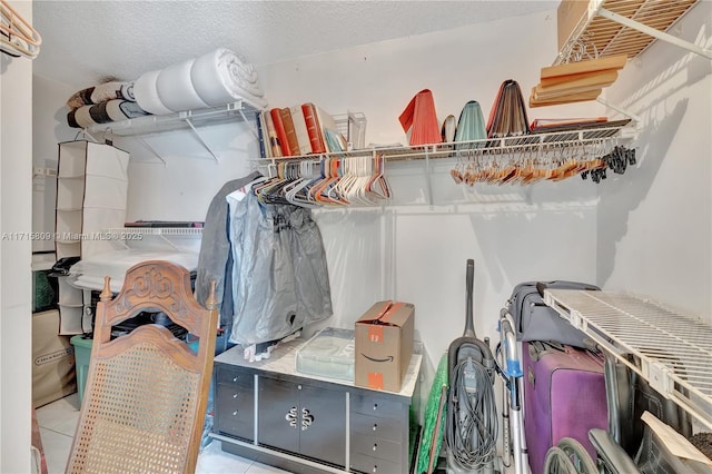 spacious closet featuring light tile patterned floors