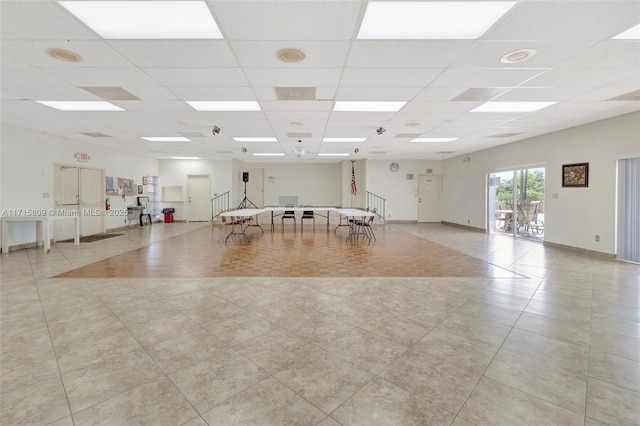 interior space featuring a drop ceiling