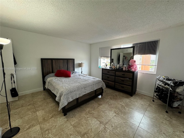 bedroom featuring a textured ceiling