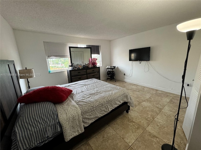 bedroom featuring a textured ceiling