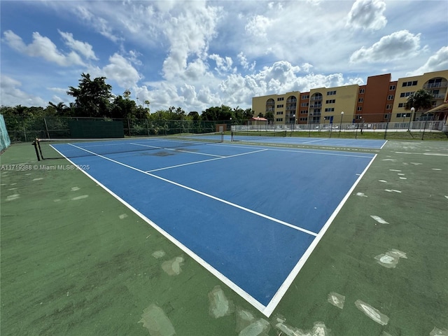 view of sport court with basketball hoop