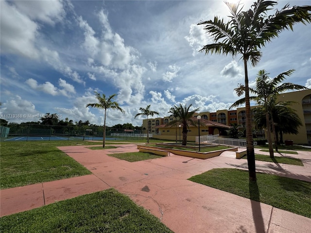 surrounding community with tennis court