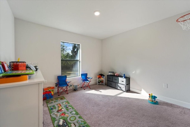 recreation room with light carpet