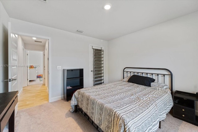 bedroom with light carpet