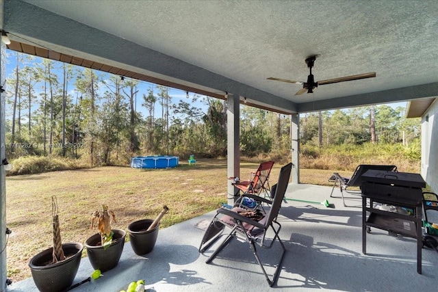 view of patio / terrace featuring ceiling fan