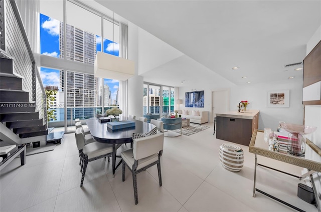 dining space with a high ceiling and sink