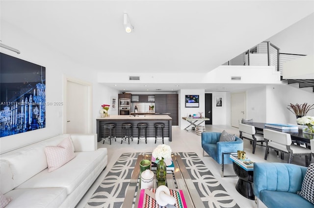 tiled living room featuring sink