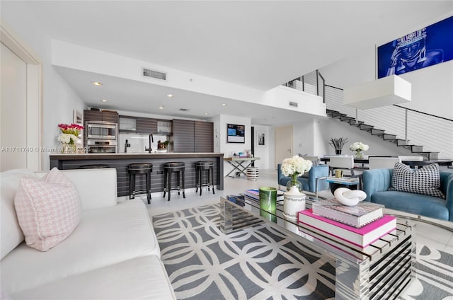 living room featuring light tile patterned flooring