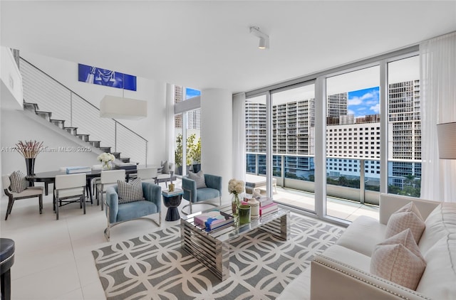 tiled living room with a wall of windows