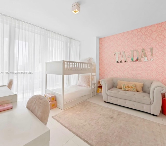 bedroom with light tile patterned flooring and multiple windows