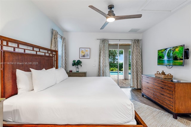 bedroom featuring hardwood / wood-style floors, ceiling fan, and access to outside