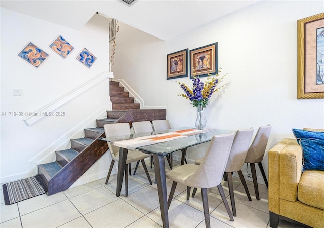 dining room with light tile patterned flooring