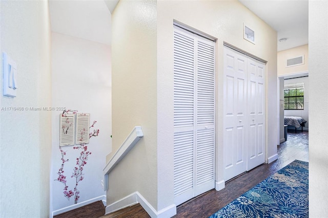 corridor with dark hardwood / wood-style floors