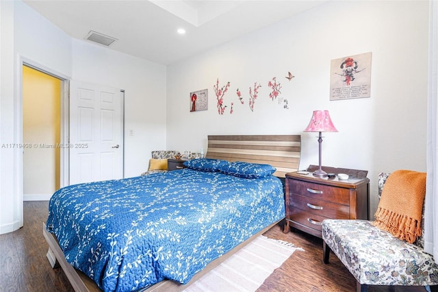 bedroom with hardwood / wood-style floors