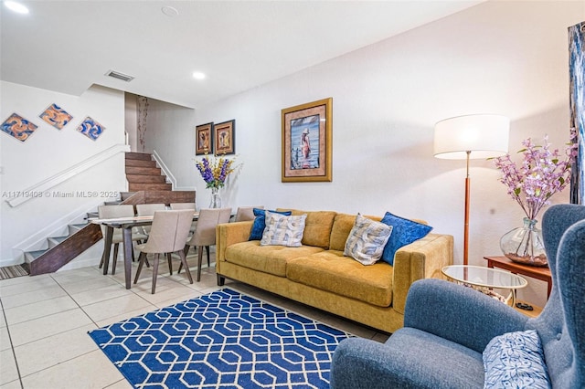 living room with tile patterned floors